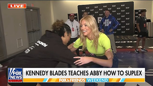 Shocking moment glamorous Fox reporter gets bodyslammed on live TV to leave colleagues stunned