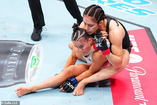 Medics rush to save glamorous UFC fighter after she is KO’d and then choked out in horrifying moment