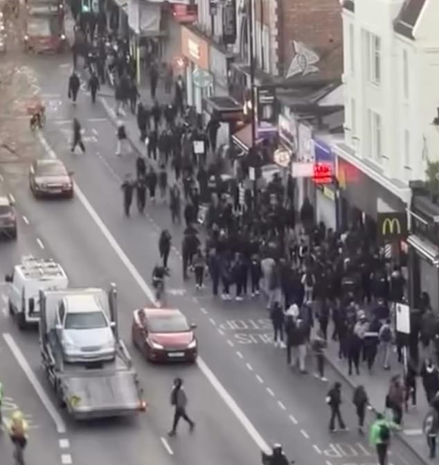 Families ‘are barricaded inside high street stores’ as mobs of youths storm Clapham AGAIN
