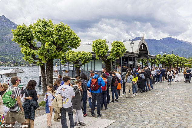 The idyllic Italian town turned into ‘Gotham City’ by hordes of tourists: Como mayor goes to war against lakeside al fresco diners wrecking lake and mountain views