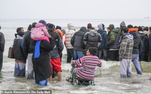 Two migrants die trying to board Britain-bound small boat near Calais – hours after UK agreed to pay France millions to patrol beaches