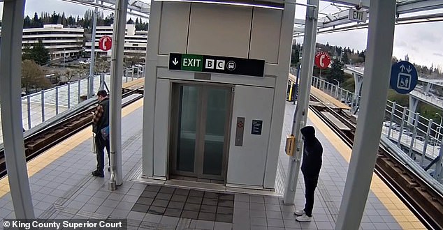 Man looking at his phone while standing on train platform suffers every commuter’s worst nightmare at hands of vile stranger who was watching him from behind elevator