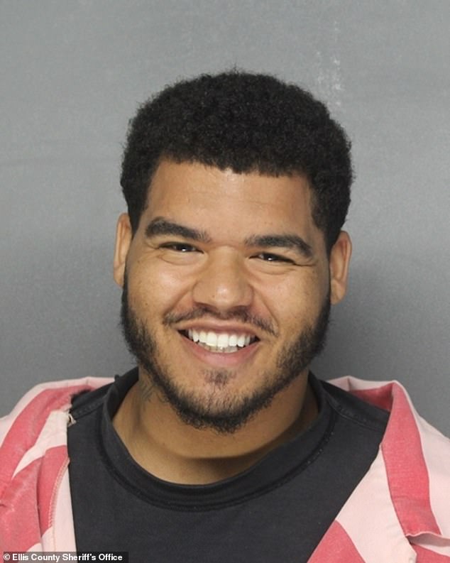 Ex-Cowboys star grins for sickening mugshot following arrest for allegedly assaulting pregnant woman