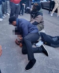 Moment teenage ‘shoplifter’ is pinned to the road in Mayfair by security guards seconds after ‘stealing shoes from nearby shop’