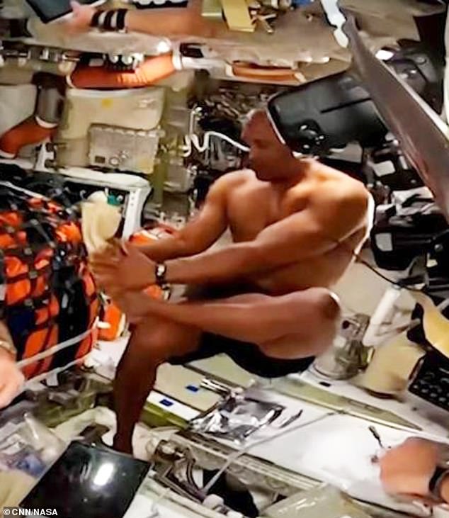 It’s one giant treat for womankind as musclebound astronaut Victor Glover is caught on camera taking a post-workout ‘space shower’