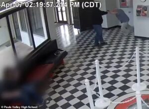 Incredible moment hero high school principal bursts through door and tackles gunman while getting shot