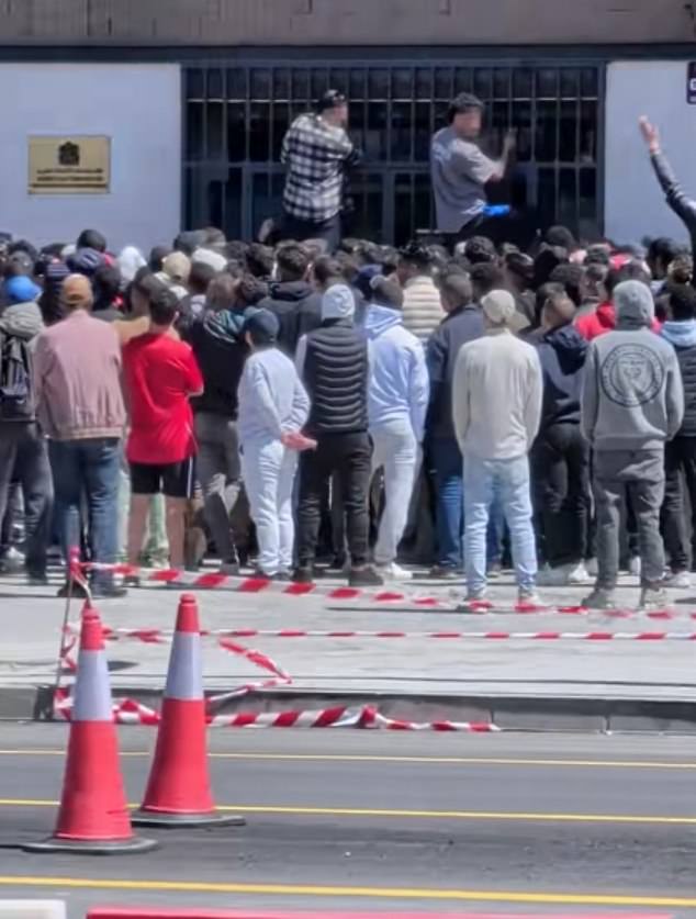 Thousands of migrants descend on consulates across Spain after socialist government gave the green light to give 500,000 legal status