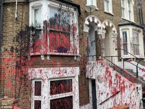Residents ‘traumatised’ after row of houses are daubed with red and black paint in latest mysterious ‘brothel’ attack across Britain