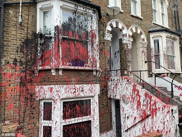 Residents ‘traumatised’ after row of houses are daubed with red and black paint in latest mysterious ‘brothel’ attack across Britain