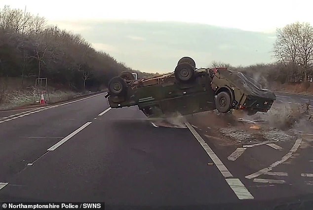 Moment military Land Rover flips into the air and throws driver out of his vehicle after he was forced to swerve out the way of reckless motorist