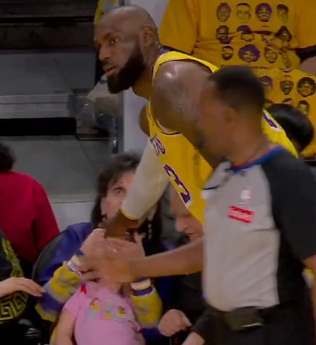 LeBron James rushes over to young fan after accidentally hitting her with ball during Lakers playoff game