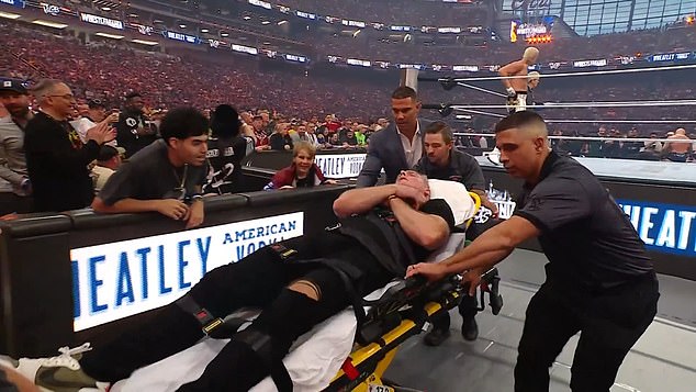 Pat McAfee leaves WrestleMania on a stretcher as ESPN host is brutally smashed through table