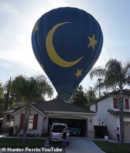 Homeowners’ shock as hot air balloon makes emergency crash landing in their backyard