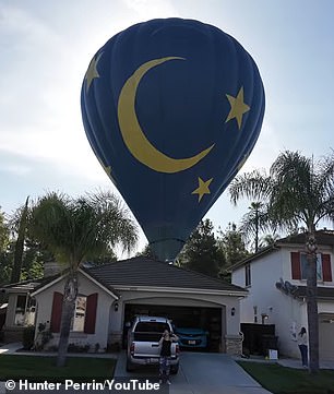 Homeowners’ shock as hot air balloon makes emergency crash landing in their backyard