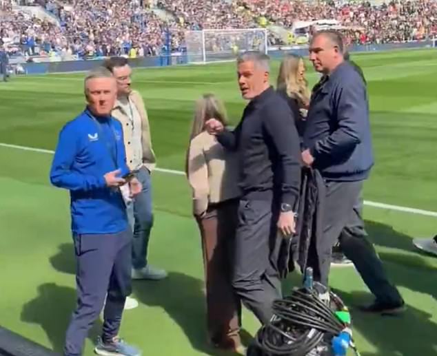 Jamie Carragher walks away from Everton fans after barrage of insults are directed at the Liverpool legend during Merseyside derby