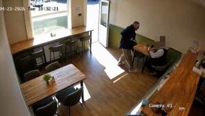 Moment knifeman casually walks into café and randomly stabs diner who fights back by punching him in the head – as police arrest man in his 50s over ‘double stabbing’