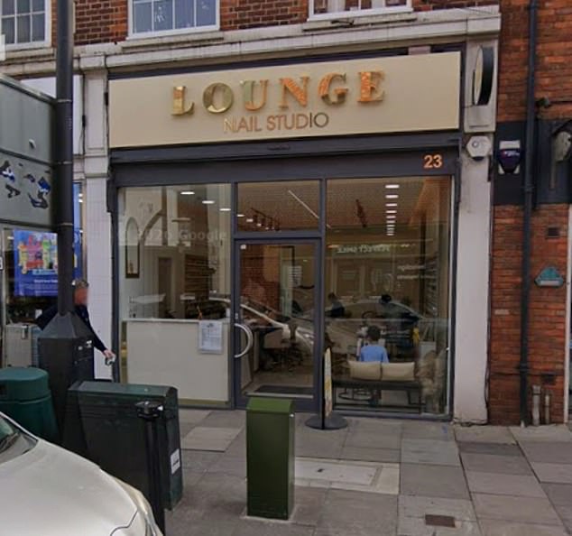Young man is rushed to hospital after being ‘stabbed’ at nail salon: Woman, 21, is arrested