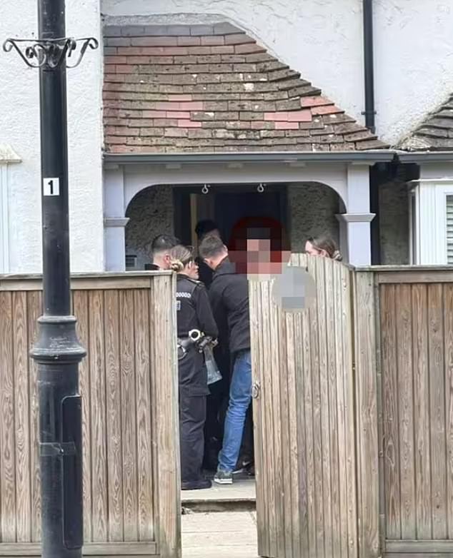 Afghan asylum seeker is arrested for ‘harassing schoolgirls’ after migrants were moved into £500,000 home in leafy Surrey village without telling residents