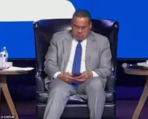 Shameful moment Minnesota’s Democrat AG uses his phone while sat on stage at event as woman in audience cries while telling sad story