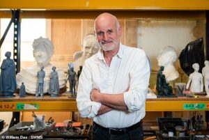 Sculptor behind Elizabeth II memorial statue defends decision to not portray late Queen on horseback – after critics said she was ‘unrecognisable’ 