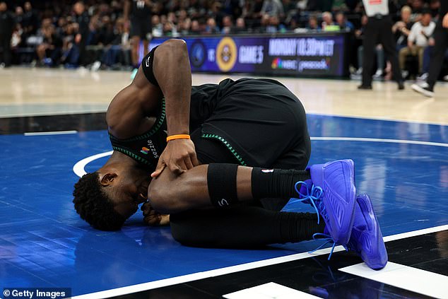 Sickening moment Timberwolves star Anthony Edwards suffers horror knee injury as he’s helped back to locker room after brutal landing