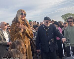 Madness frontman Suggs sings at emotional vigil for Finbar Sullivan, 21, who was stabbed to death at Primrose Hill