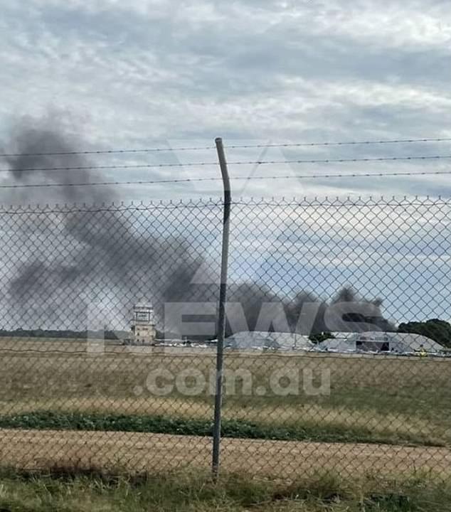 Emergency as small plane crashes into Parafield Airport as hangar bursts into flames