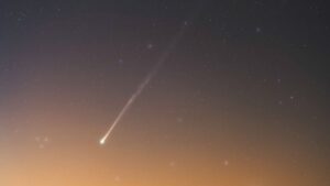 See Comet PanSTARRS glow above a false dawn in stunning new photo