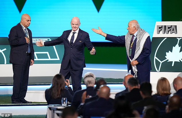 Remarkable moment FIFA’s blundering president Gianni Infantino tries – and fails – to get Israel and Palestine football chiefs to shake hands on stage