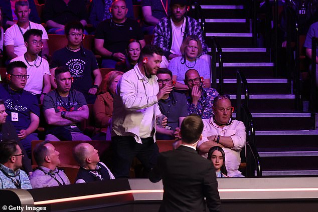 Snooker fan is THROWN OUT of World Championship semi-final for bizarre Epstein Files outburst in more chaos at the Crucible