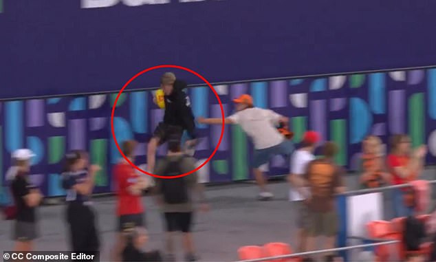 See the hilarious moment a young AFL fan grabs the match ball and runs straight out of the stadium