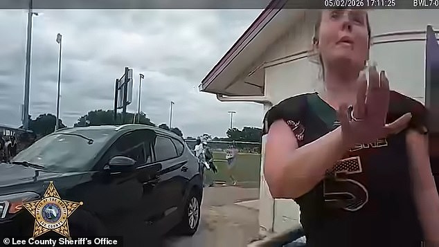 Florida mom’s foul-mouthed arrest caught on camera as she is detained for ‘storming the field and kicking a child’ during youth football game