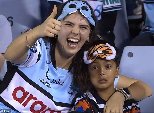 Five-year-old footy fanatic goes viral after being pictured crying his eyes out on TV – as some fans say clip shouldn’t have been broadcast