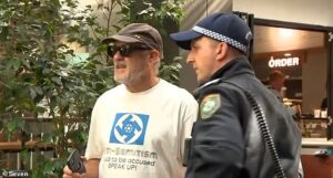 Chaos at Bondi Royal Commission as man in swastika shirt interrupts proceedings