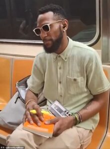 Beautifully dressed NYC man hit with vile threats after asking fellow subway rider not to play music from a speaker