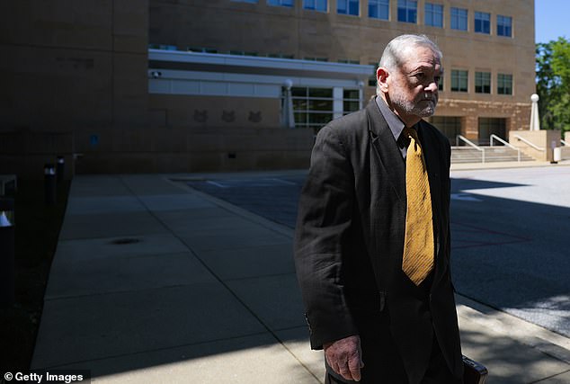 Dr Fauci’s top aide’s face says it all as he’s booked in court on federal charges for ‘COVID cover up’