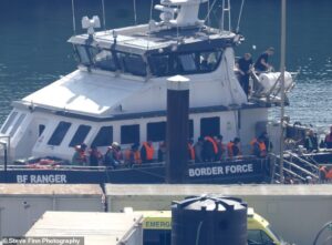 SUE REID: The moment Britain’s 200,000th Channel migrant landed in Dover after being ‘plucked from rubber boat’
