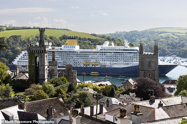 ‘What a horrible sight despoiling both land and sea!’: Cornish residents are in uproar as 58,000-ton cruise ship that can carry 1,500 docks in their picturesque town (population 2,240)