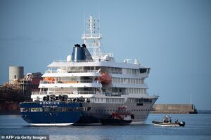 Evacuation of rat virus cruise FINALLY under way despite furious protests from locals… but Americans are forced to wait on board