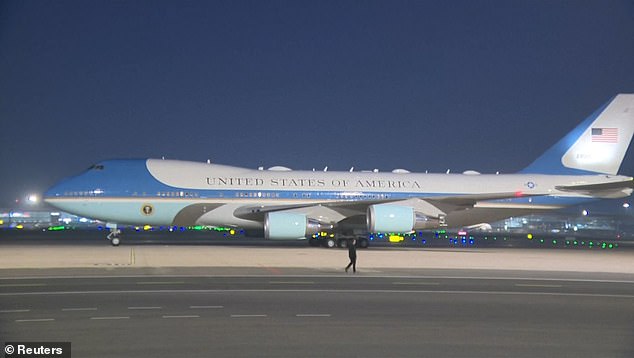Trump smiles and fist pumps as he’s greeted by 300 chanting Chinese kids waving American flags as he prepares to meet Xi amid Iran tensions