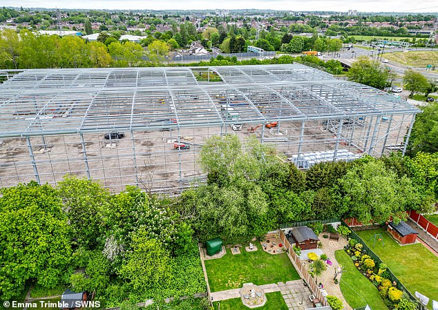 We live in shadow of half-built giant mega-shed… our lives are made hell by monster metal skeleton which shakes homes and damages roofs