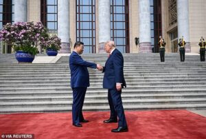 Trump’s hidden five-tap code in handshake with Xi… and the tell-tale ‘bullfrog smile’ that betrayed the president