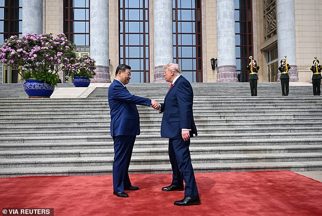 Trump’s hidden five-tap code in handshake with Xi… and the tell-tale ‘bullfrog smile’ that betrayed the president