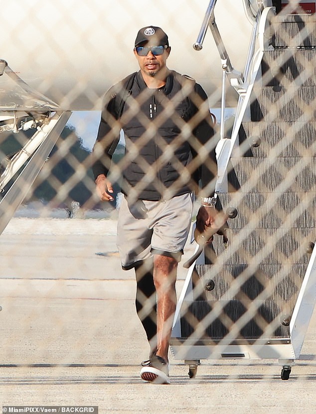 Tiger Woods seen for the first time since DUI arrest as he returns from Swiss rehab with beloved dogs by his side