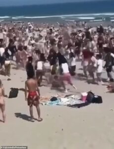 Teen mayhem breaks out on Rhode Island beach with three stabbed and hundreds sent fleeing