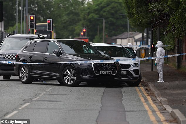 Armed police shoot motorist, 20, who drove directly at them while trying to flee