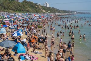 Feeling hot, hot, hot… Britain hits 32C today and faces first ever May ‘tropical night’ as heat records set to be broken