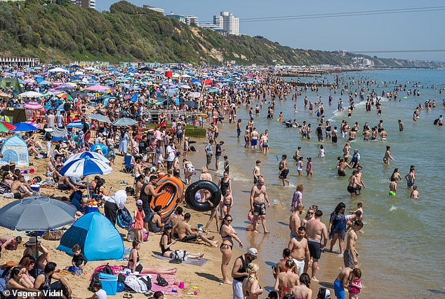 Feeling hot, hot, hot… Britain hits 32C today and faces first ever May ‘tropical night’ as heat records set to be broken