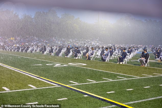 High school faces backlash as graduation is held in torrential downpour