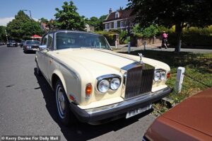 The mysterious war in one of Britain’s most affluent neighbourhoods: Desperate villagers locked in parking battle with Rolls Royce owner leaving his cars outside their homes… and they’re powerless to stop him